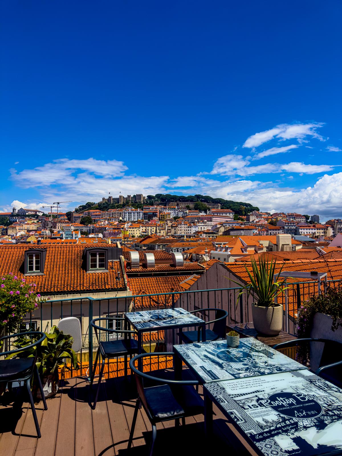 The Art Inn rooftop terrace with São Jorge Castle above the Lisbon rooftops